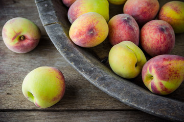 group of fresh peaches on wood background