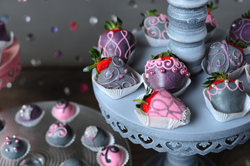 Variety of fruits covered with a color chocolate