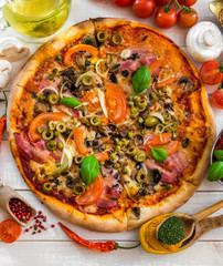 Pizza with ham and olives