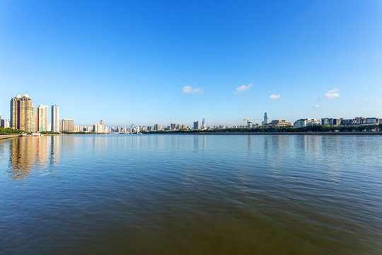 skyscrapers by the river bank