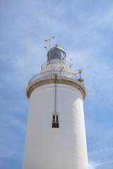 Fototapeta na wymiar White whitewashed lighthouse