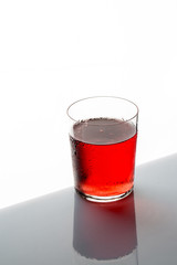 glass of cocktail  cherry on white background