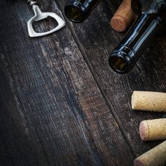 Fototapeta na wymiar Bottle of wine, corks and corkscrew