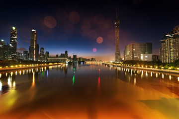 Obraz premium architectures and neon light along the river