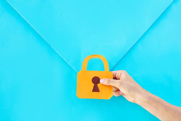 security of information concept. hand holding a lock 