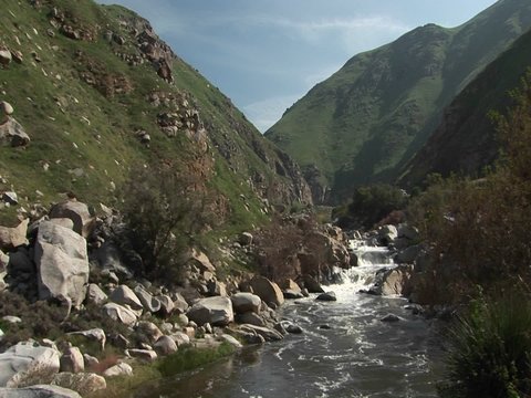 Wide shot of the  Kern River Flowing down falls Through a Canyon in the Sierra Nevada Mountains.