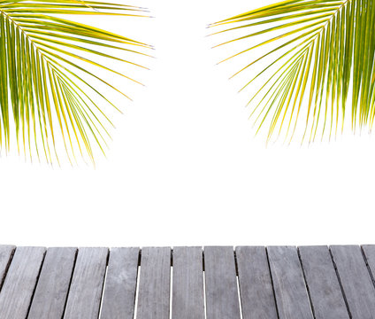 Wooden pier and palm tree leafs silhouette on white