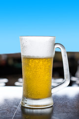 Glass of beer on table