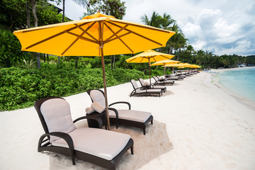 Sun umbrella and beach beds on  beach