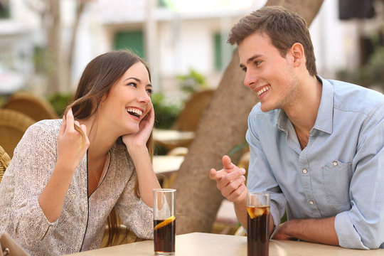 Couple dating and flirting in a restaurant