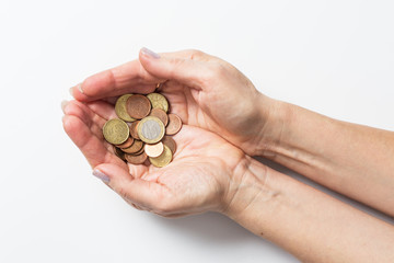 Two hands holding coins