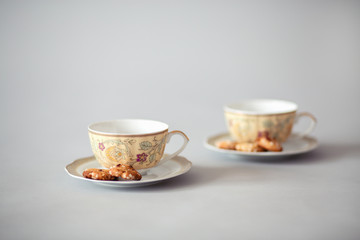 Tea cups with cookies