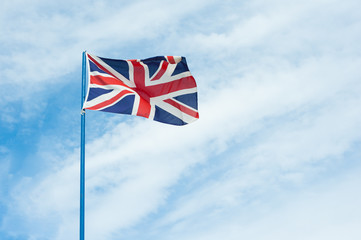 British flag in cloudy sky