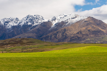 green field and mountain landscape