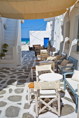 Tables in the street in Naousa village on Paros island, Greece
