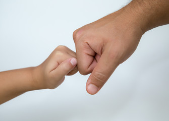 fist bump symbol between father and child