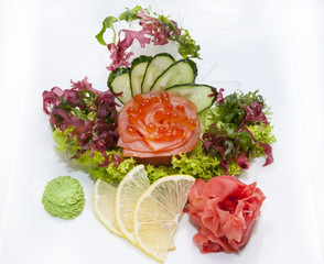 Japanese cuisine sashimi with vegetables and fish in a restaurant