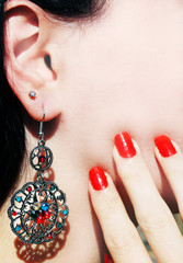 earrings jewellery with bright crystals in ear