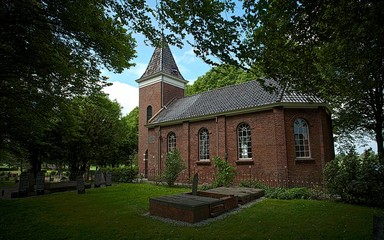 Fototapeta na wymiar Medieval church with graveyard