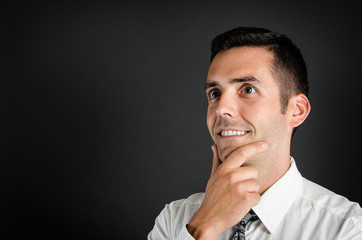 Image of a man wearing a shirt and tie looking into the future