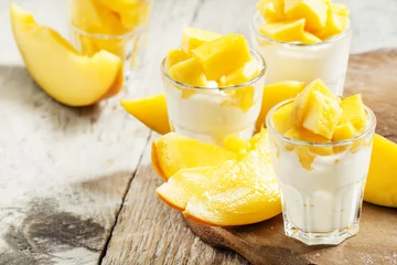Gordijnen Homemade yogurt with fresh mango slices, selective focus © 5ph