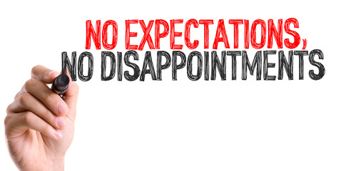 Hand with marker writing: No Expectations, No Disappointments