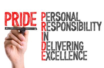 Hand with marker writing: Pride Acronym