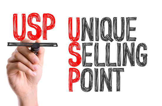 Hand with marker writing: Unique Selling Point