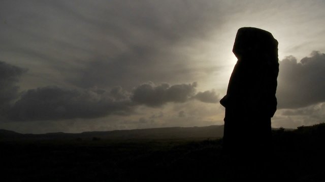 Time lapse of amazing clouds with Easter Island statues in silhouette.