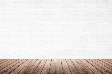 interior room with brick wall and wood floor