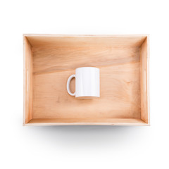Top view of  wooden box with white cup inside