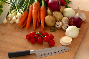 Pile of organic vegetables on a wooden table