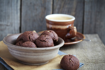 Italian chocolate cookies with walnuts and a cup of coffee 