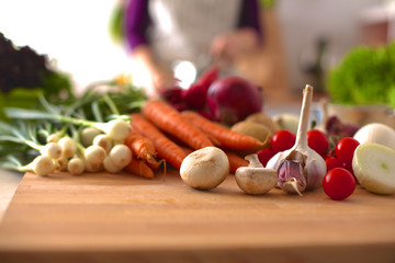 Young Woman Cooking in the kitchen. Healthy Food