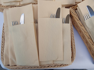 cutlery set inside folded table napkins