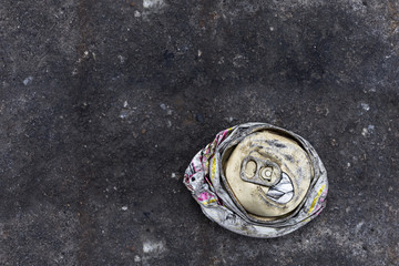 crushed can on the road