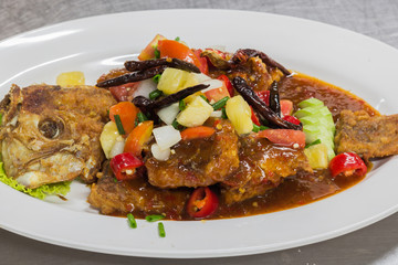 Close up deep fried fish with thai style sweet and sour sauce
