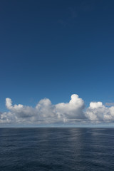 Clouds and blue sky in Atlantic ocean, summer time