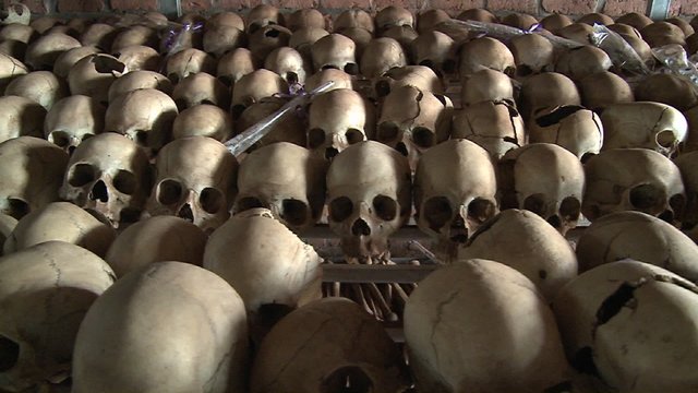 Thousands of skulls in long rows remember the genocide in Rwanda.