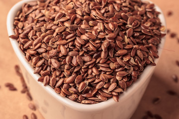 Flax seeds linseed in white bowl