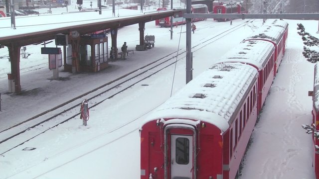 The train station in St. Moritz Switzerland during a snowstorm.
