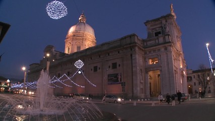 Christmas decorations around an Italian church square.