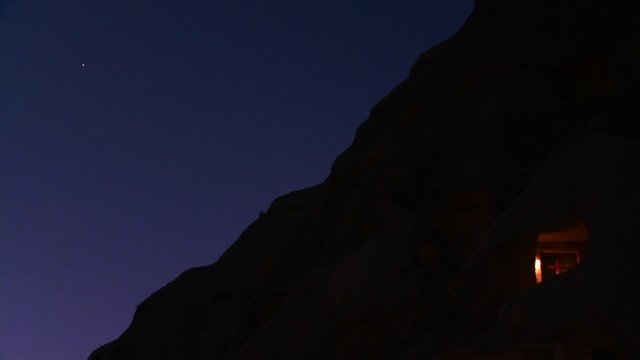 A room is illuminated under the stars at night at Cappadocia, Turkey.