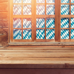 Oktoberfest background with empty wooden table over window