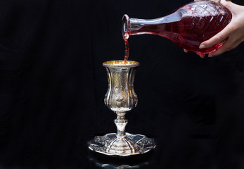 Pouring red wine into a glass Silver