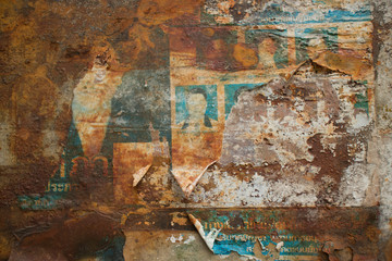 Horizontal View of Weathered Grungy paper Flyers on Rusty Metal
