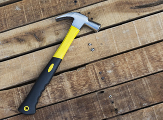 Hammer with clipping path on wooden table