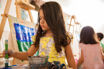 Little artist in art class