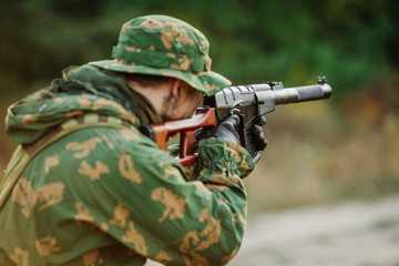Fototapeta premium russian soldier in the battlefield with a rifle
