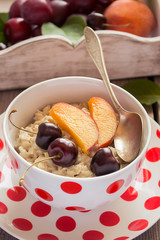 Healthy Breakfast. Oatmeal porridge with fruits.